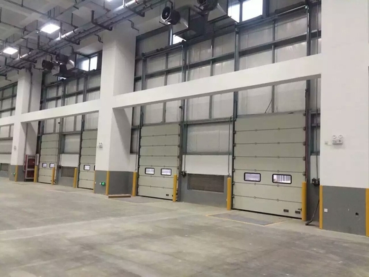 Sectional doors open vertically and are suspended under the ceiling, that the space outside and inside can be utilised